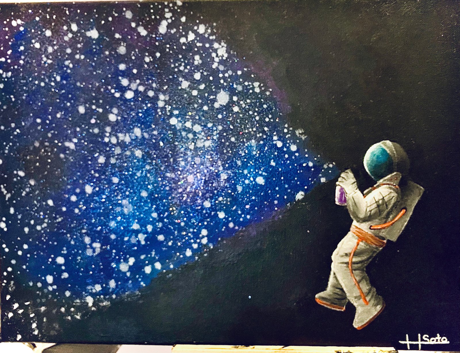  an astronaut floating in space holding a spray can. all the stars and colors of the galaxy are being sprayed out of the can.